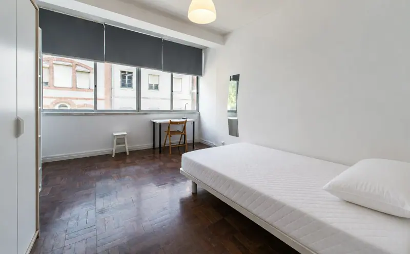 Bright bedroom with a wide window in Number 11